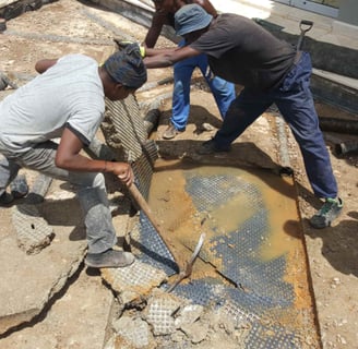 Removal of old waterproof membrane layer for advanced slab waterproofing project, Sandton, Fredman Drive