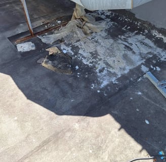 Flat slab with exposed steel and concrete spalling due to waterproofing failure