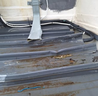 Overflowing roof gutter with poor drainage