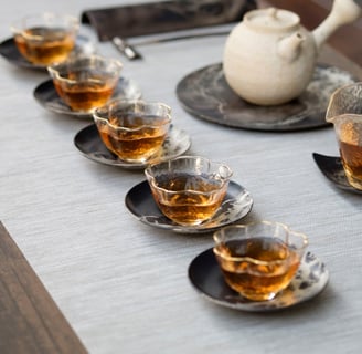 a table with tea cups and tea cups