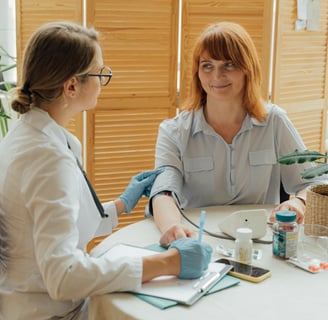Doctor discussing importance of annual wellness exams for female patient over 40