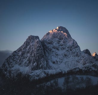 a mountain scene with a mountain range in the background