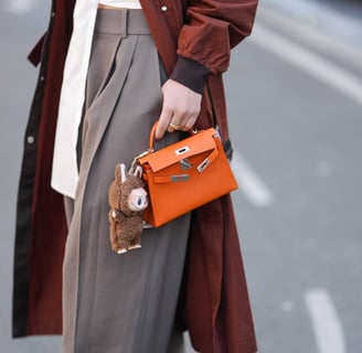 Photo of a Labubu Zimomo bag charm on a Hermes bag