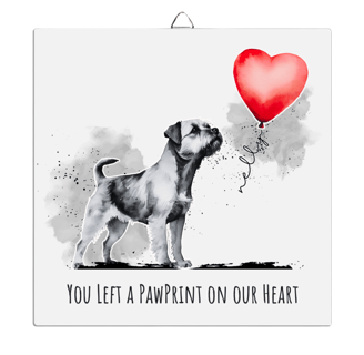 a dog with a balloon in the shape of a heart