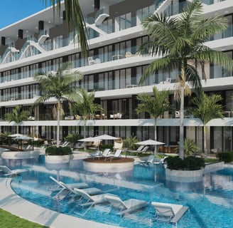 a large swimming pool with lounge chairs and umbrellas