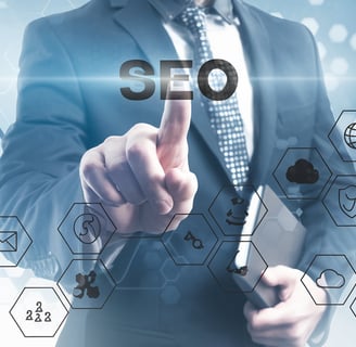 Business owner analyzing SEO reports on laptop for local search visibility