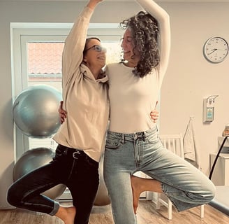 a woman doing yoga poses with a man
