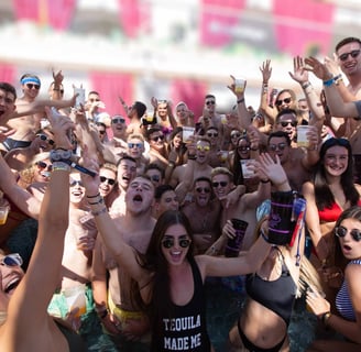 High-energy crowd partying at a Las Vegas dayclub during a poolside crawl