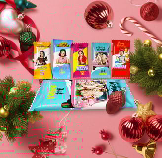 a variety of candy bars on a pink background