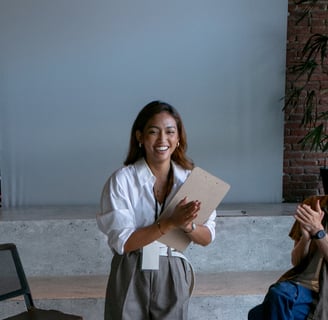 a woman in a white shirt and a man in a chair