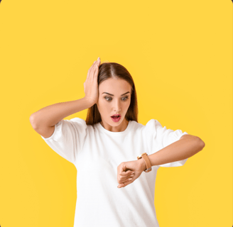 a woman looking a watch on her wrist with her hand on her head looking worried