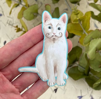 a white cat sticker with moustache