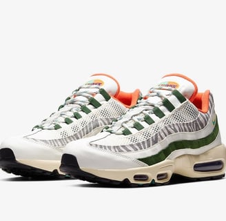 Nike Air Max 95 'Era' sneaker in vintage white, gray, and black with layered side panels and visible Air cushioning