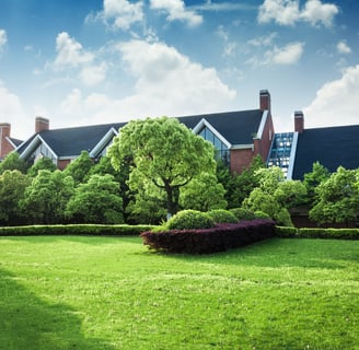 a large house with a lawn and a lawn