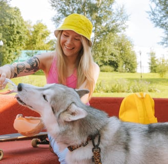 a dog drinking water from a bottle
