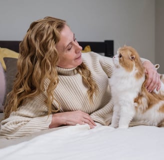 A woman holding a cat