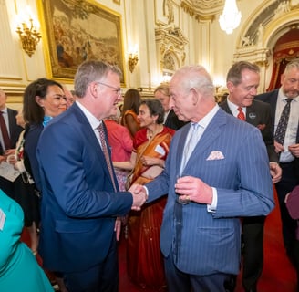 King is shaking hands