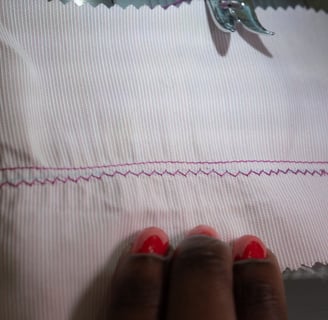 Overlock stitch on pink fabric