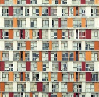 Symmetrical facade of colourful apartment balconies in an urban art photograph by Martin Osner