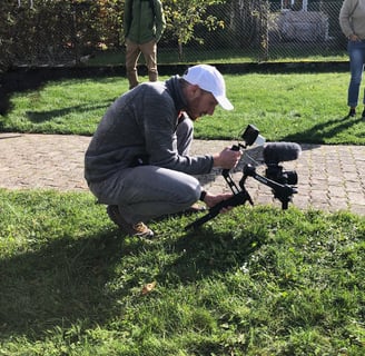 a man is taking a picture of a camera and a camera