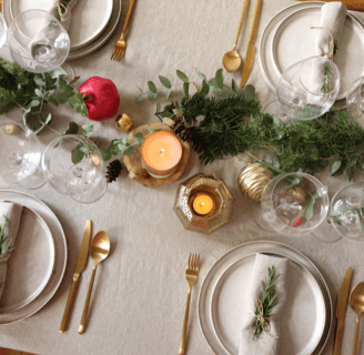 table decorating with lamps candles and plates and knife with fork