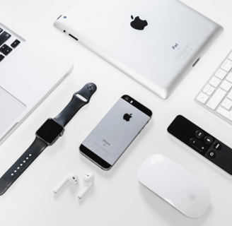 an apple products on the table watch ,phone,i pods,etc