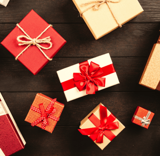 many gift boxes with ribbon on it