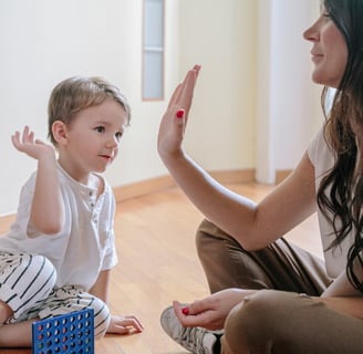 a mother doing hi fi with baby