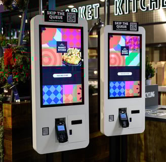 two self service touchpoints in a Cafe