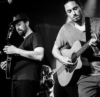 andrew brantley on stage acoustic guitar