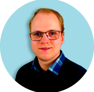 a man with glasses and a blue shirt
