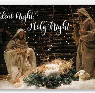Nativity scene with fairy lights in background