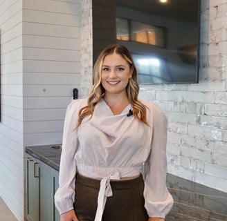 a woman in a white blouse and brown pants Houston Texas Real Estate Agent Stephanie Adams Ask Ozzie 