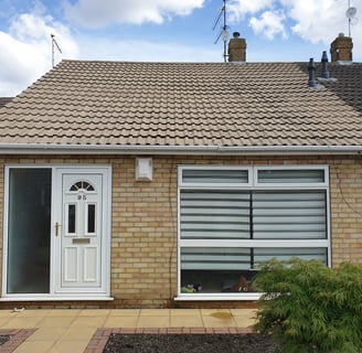 After photo of a bungalow roof in Hull, professionally jetwashed to remove moss and grime, revealing clean roof tiles