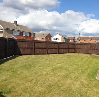 After photo of a freshly painted garden fence in Hull, showcasing a smooth, clean finish and enhanced kerb appeal