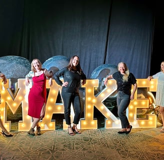 Women posing with Make Wellness Letters M.A.K.E.