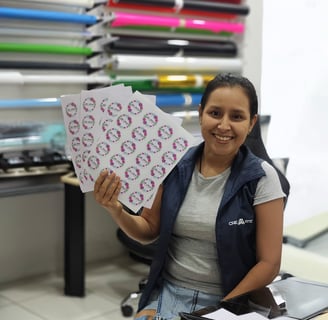 a woman holding a piece of paper with a picture of a woman holding a piece