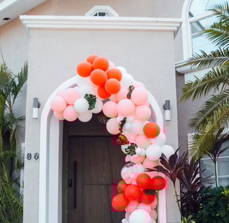 a colorful arch shaped balloon - shaped arch with balloons