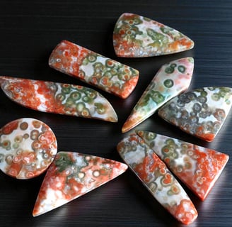 red ocean jasper cabochons rare collectors material with red and green orbs