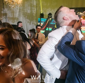 Antigua Guatemala wedding photographer-groom drinking at party