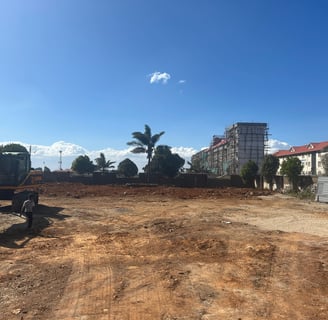 a construction worker is standing in front of a construction site