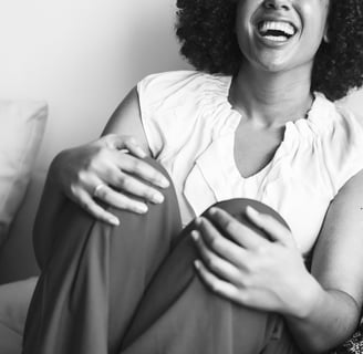 a woman sitting on a couch with a cup of coffee and taking care of your mental health