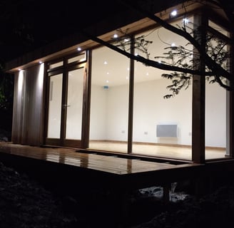 night image of a garden room with spotlights