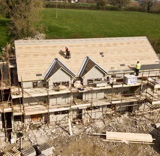 house building with scaffholding