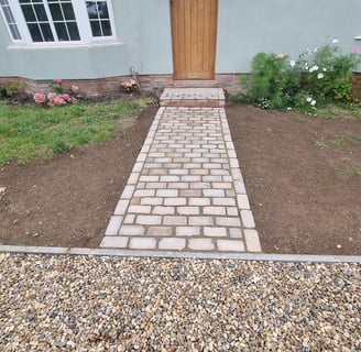 Cobbled pathway from natural stone sets 200mm X 100mm 