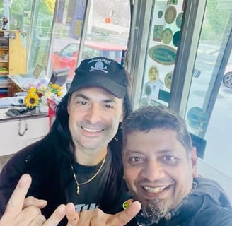 Gas station owner and rock band front man helping fix my motorcycle in Italy