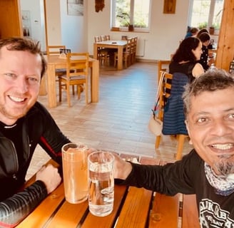 Enjoying a drink with fellow motorcyclist in Czechia