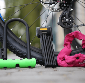 a bicycle with a pink bag on the ground