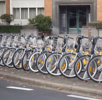 a row of bicycles parked in front of a building