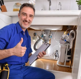 plumber is happy to see everything under the sink is working great